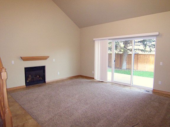 Living room with vaulted ceilings and gas fireplace
