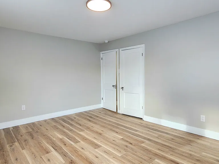 2nd floor bedroom located at rear of the home. Angle 2.