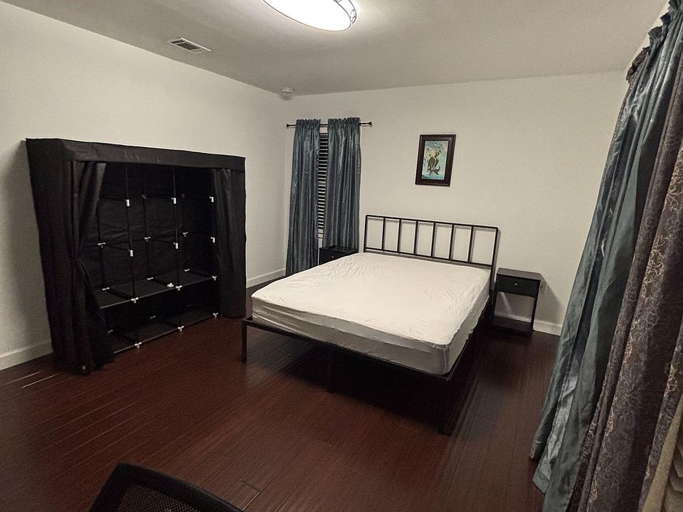 Large room with dresser and wardrobe.