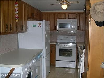 Kitchen w/ Washer & Dryer under Counter