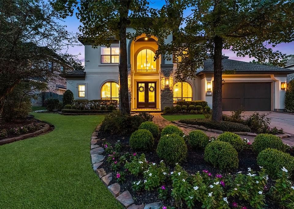 Beautiful home with lovely curb appeal and lush landscaping in the sought-after neighborhood of Old Sterling in The Woodlands.