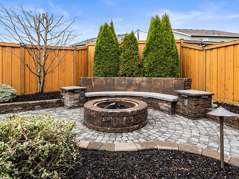 Fire pit off the back patio with built-in seating area