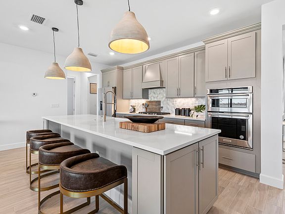 Open concept kitchen with stainless steel appliances
