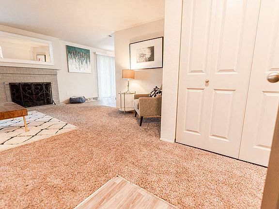 Tacoma Apartments - Sienna Park Apartments - Entryway, Living Room, and Fireplace