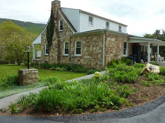 A wide variety of blossoms will decorate this flower garden all summer long!