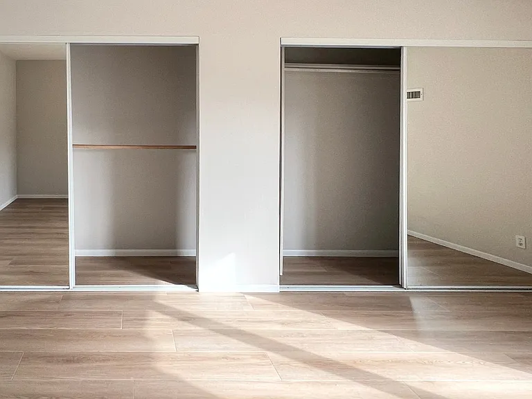Bedroom 2 double large walk-in closets with shelving