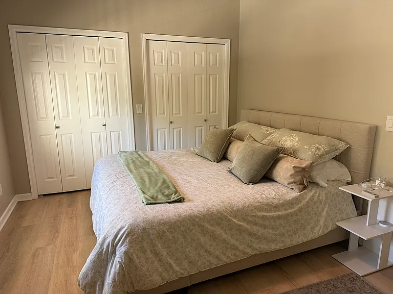 King size bed with under storage in main bedroom. Bathroom attached with walk in shower.