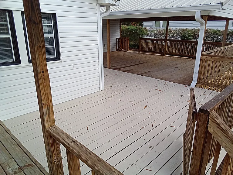large entertaining area back of house. power and lights under deck. new deck boards