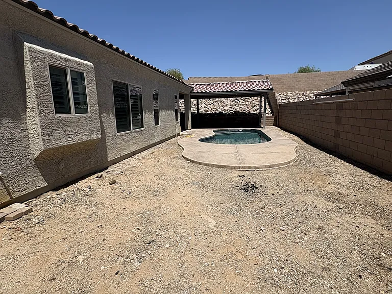 Side yard with double gate entry