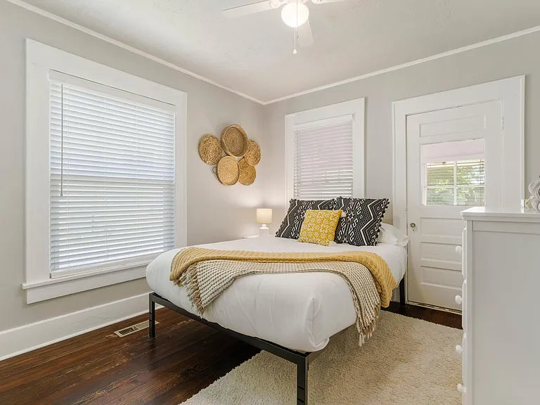 Back downstairs bedroom with sunroom