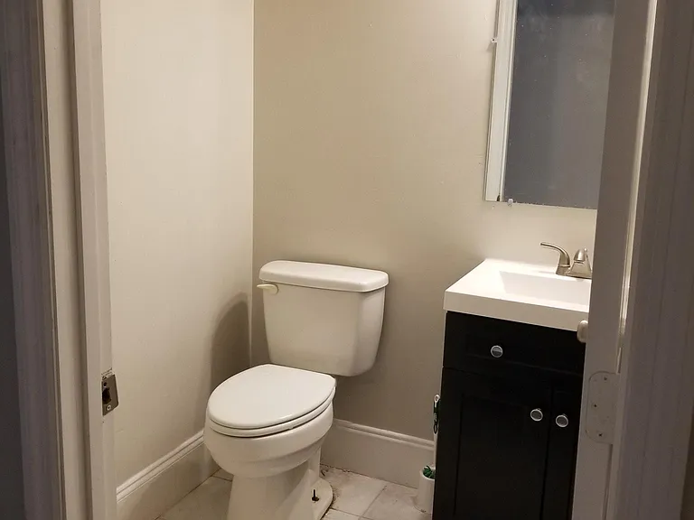 New bathroom cabinets and light fixtures in both bathrooms.