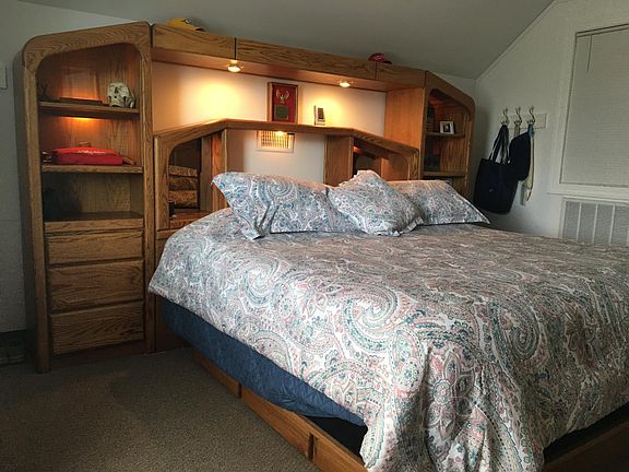 King bed with bedding provided. Plenty of storage bedside and in dressers provided.