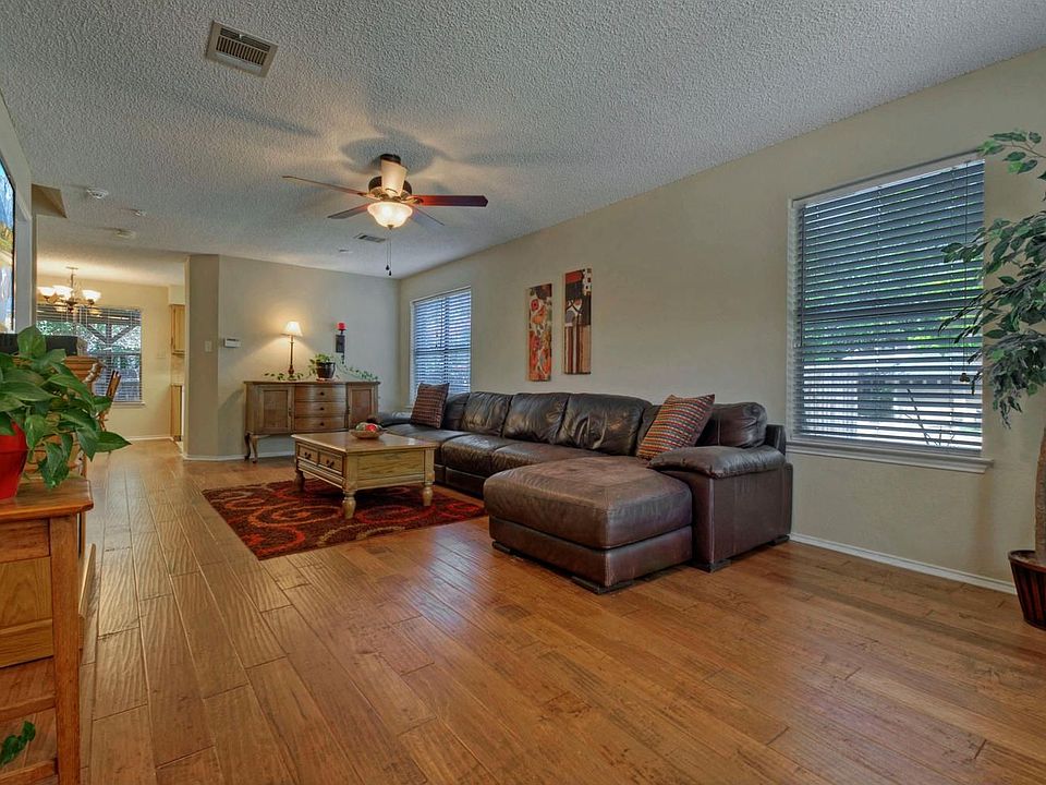 Gorgeous handscraped wood floors are the show stopper in this living room.