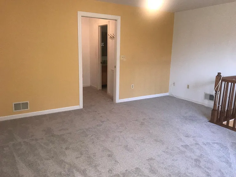 Upstairs Bedroom View to Walk-in Closet and Full Bathroom