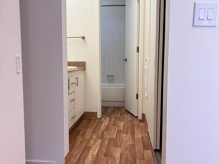 Bedroom closets. Leads into bathroom.