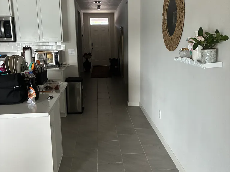 Long hall way. Bed room 1 and 2 on the left hand side . Bedroom 3 on the right side