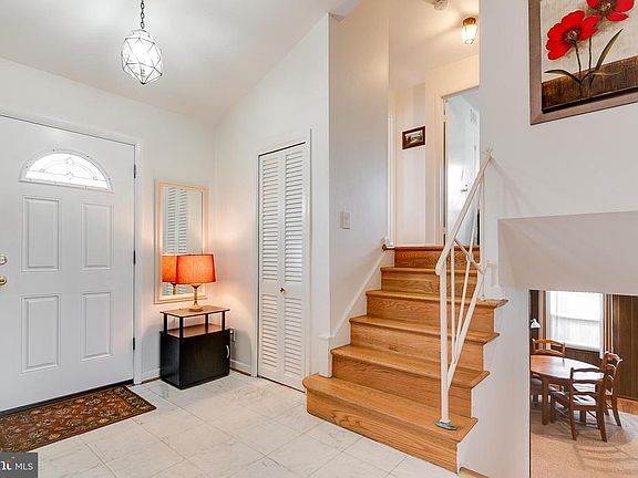 Foyer entry with HW on main and upper levels