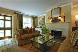 Elegantly Decorated! This is the formal living room with fireplace and hardwoo