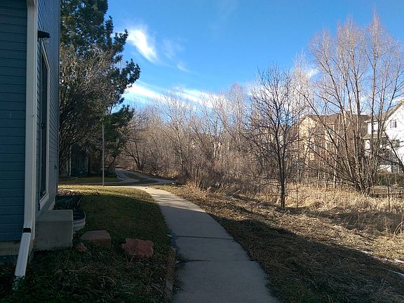 Side view of house exterior showing greenway