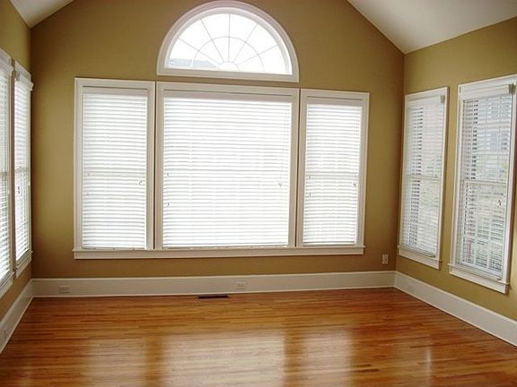 Breakfast Area with Windows Overlooking Backyard