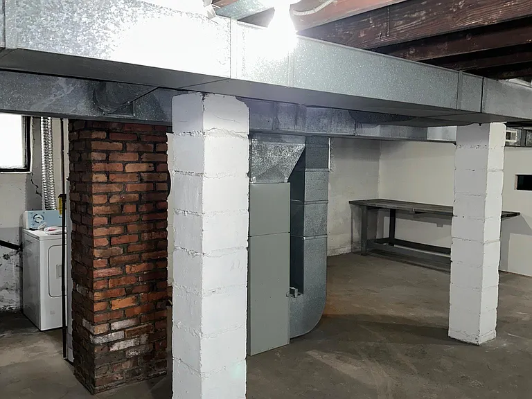Unfinished Basement with Washer and Dryer