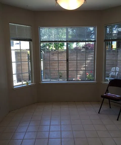 eat in kitchen with bay window, sliding door to private patio