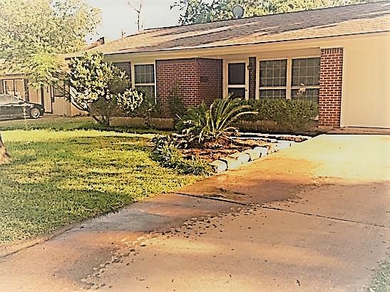 This sweet little red brick home was built in 1960, but has been thoroughly updated, while retaining its vintage charm.