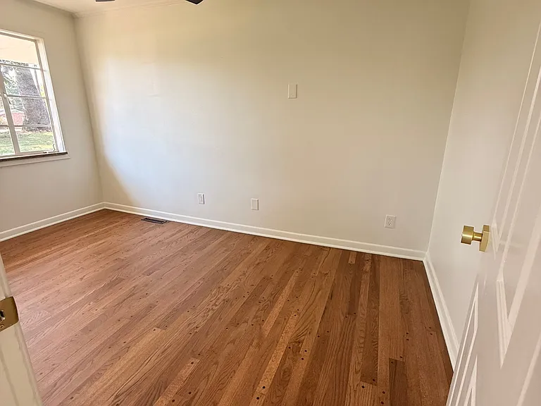 Newly refinished solid hardwood floors throughout all 3 bedrooms, main living area and dining room.