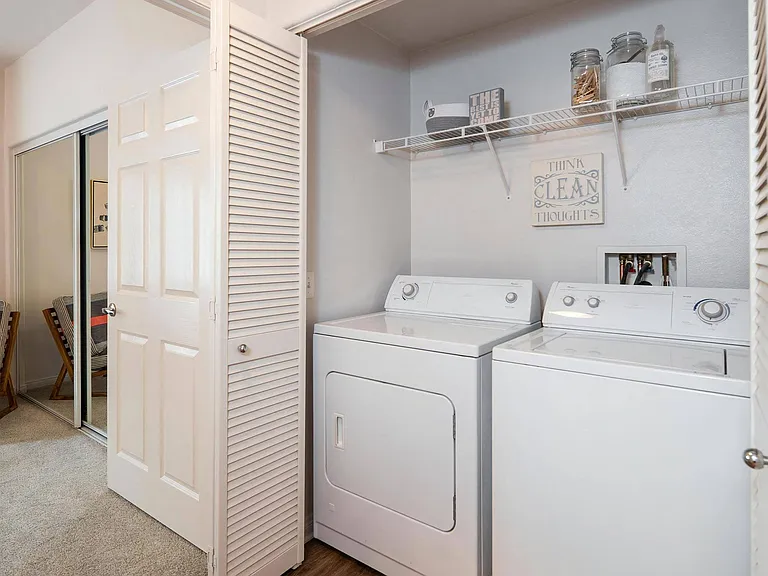 Full-Size In-Unit Washer And Dryer With Storage Shelf