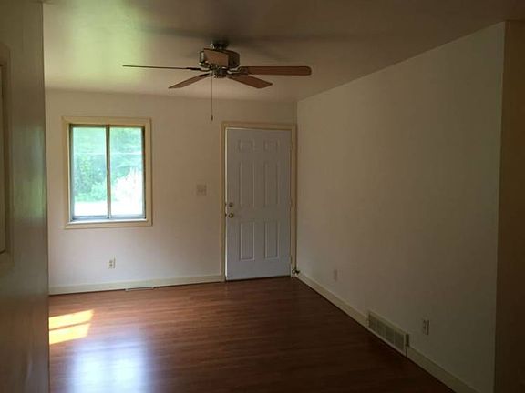 The living room has all new laminate floors.