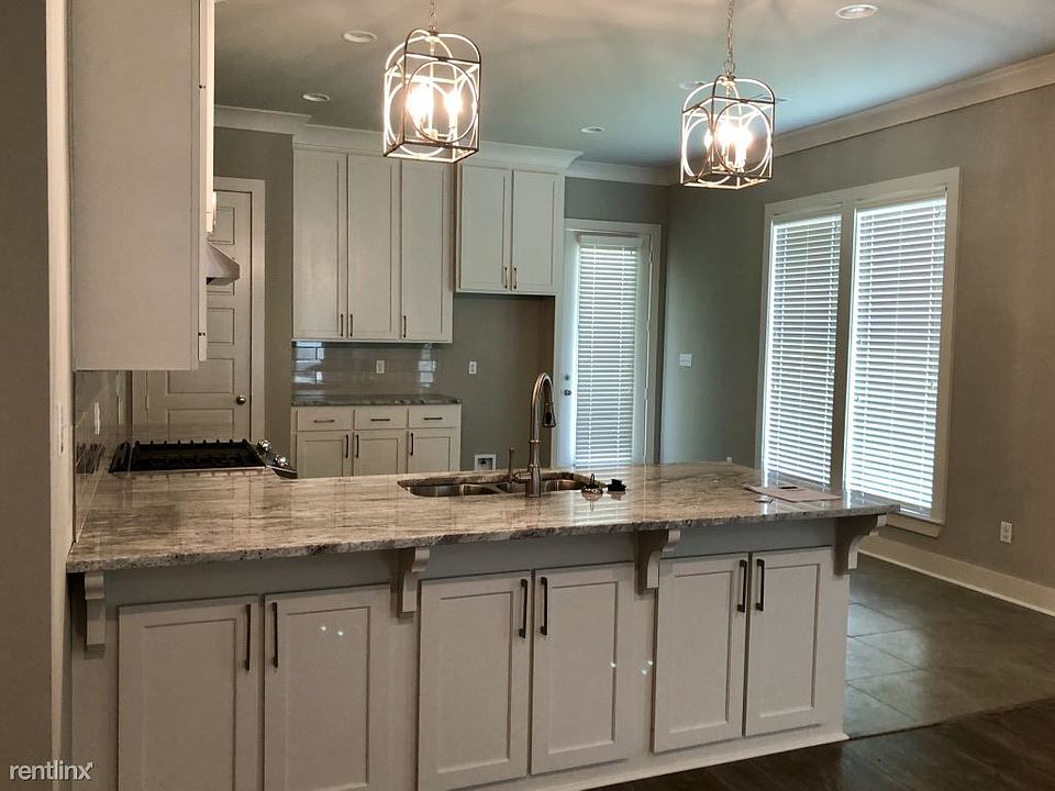 open concept kitchen/ living room/ dining room
