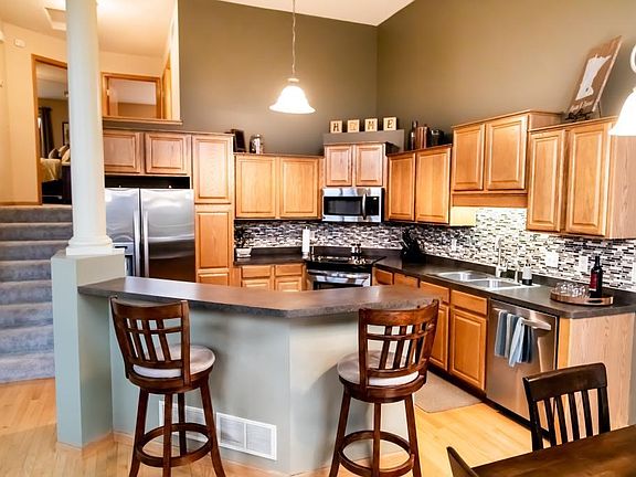 Open floor plan, stainless steel appliances and a tile backsplash will make you love this kitchen!