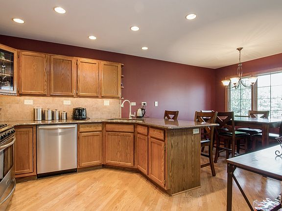 THE UPGRADED KITCHEN INCLUDES GRANITE AND STAINLESS ALONG WITH THE SOLID HARDWOOD FLOORS