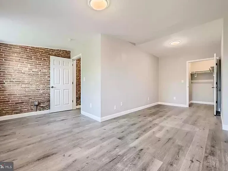 Bedroom with Walk-in Closet (empty view prior to most recent tenant moving in)