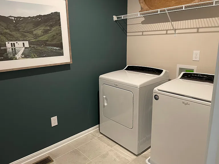 Utility room is conveniently located upstairs.