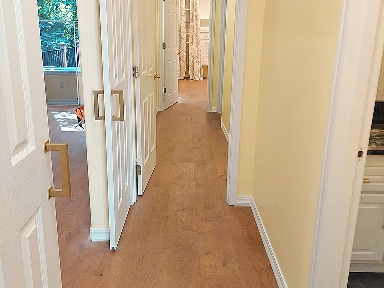 Hallway connecting all beds, baths, and living room. Barn doors add privacy, if needed
