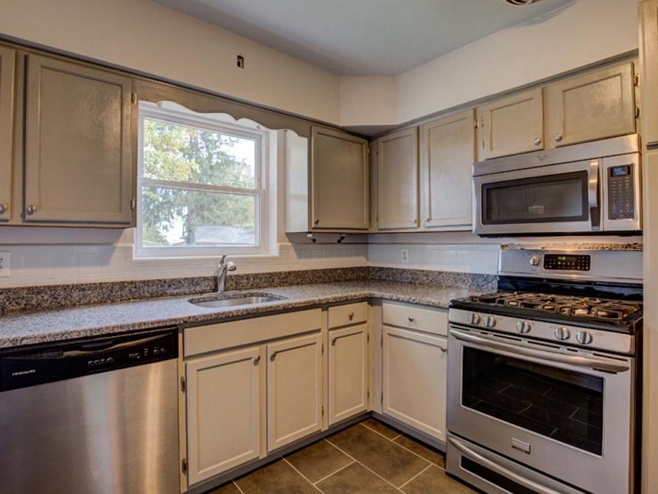 The wall with the stove is becoming a half way with a breakfast bar, open to the dining room. The stove will remain and the cabinets will be repositioned to other places in the kitchen.