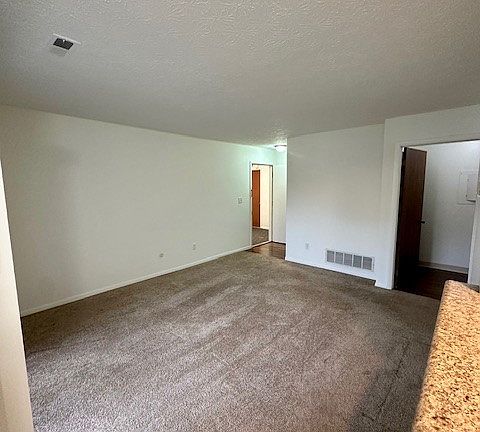 Another view of living room from kitchen bar area