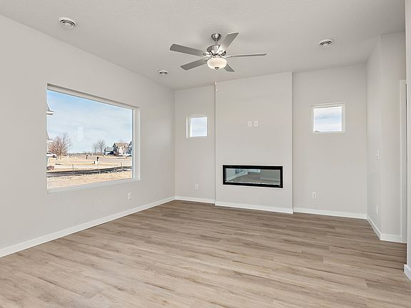 The family room is spacious with a ceiling fan.
