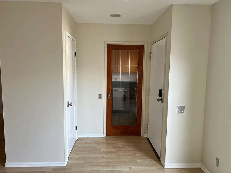 Closet in front of the front door for storage + door to close off part of the kitchen when cooking