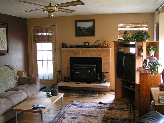 living room with wood burning stove