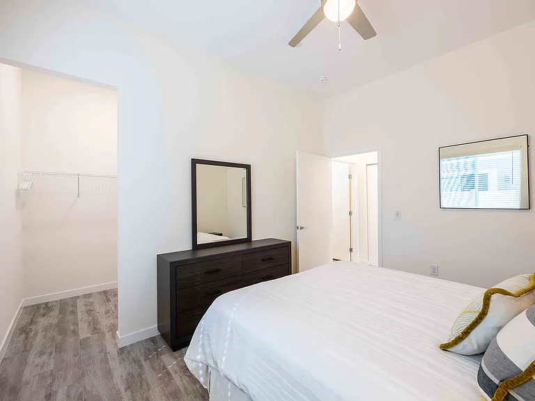 Experience comfort and style in this beautifully designed bedroom with a convenient walk-in closet.