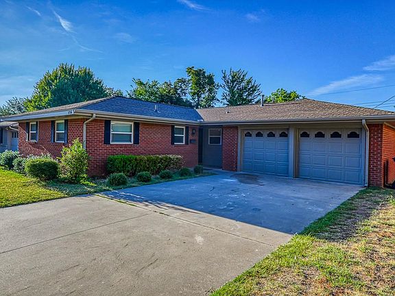 Front view of house, garage, and entry
