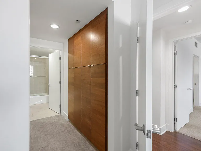 Bedroom with Bathroom and Built-In Cabinet Storage