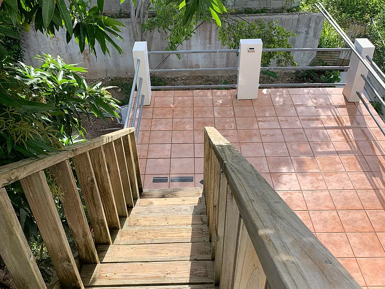 View from rooftop looking down onto entryway patio.
