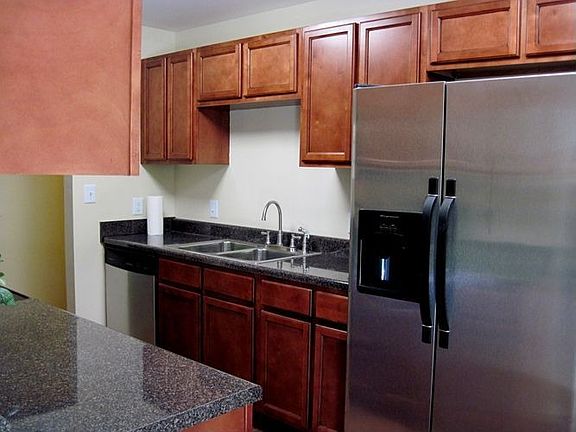 Beautiful cabinets, dishwasher and side by side fridge with ice and water disp