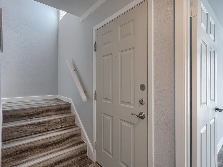 Upstairs entryway with closet and wood-style flooring
