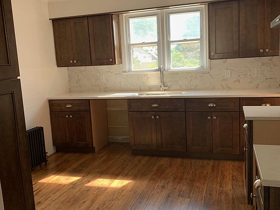 Kitchen - Brand new walnut cabinets, quartz counter tops, stainless steel appliances (on the way) including LG large 24 CuFt 33" wide Refrigerator housed in a custom cabinet; an LG 5.4 Gas range with self-clean and a Maytag Dishwasher.