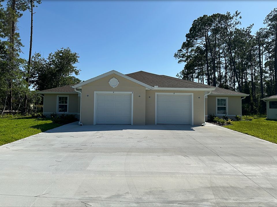 Front Driveway & Garages, Unit A (left) and Unit B (Right)