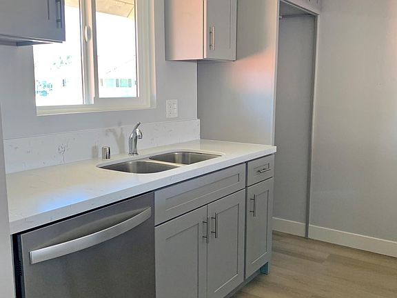 New kitchen with new solid maple cabinets, granite countertop, sink, dishwasher and fixtures